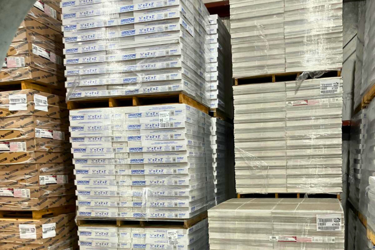 High-quality ceiling tiles being installed correctly to meet building standards.